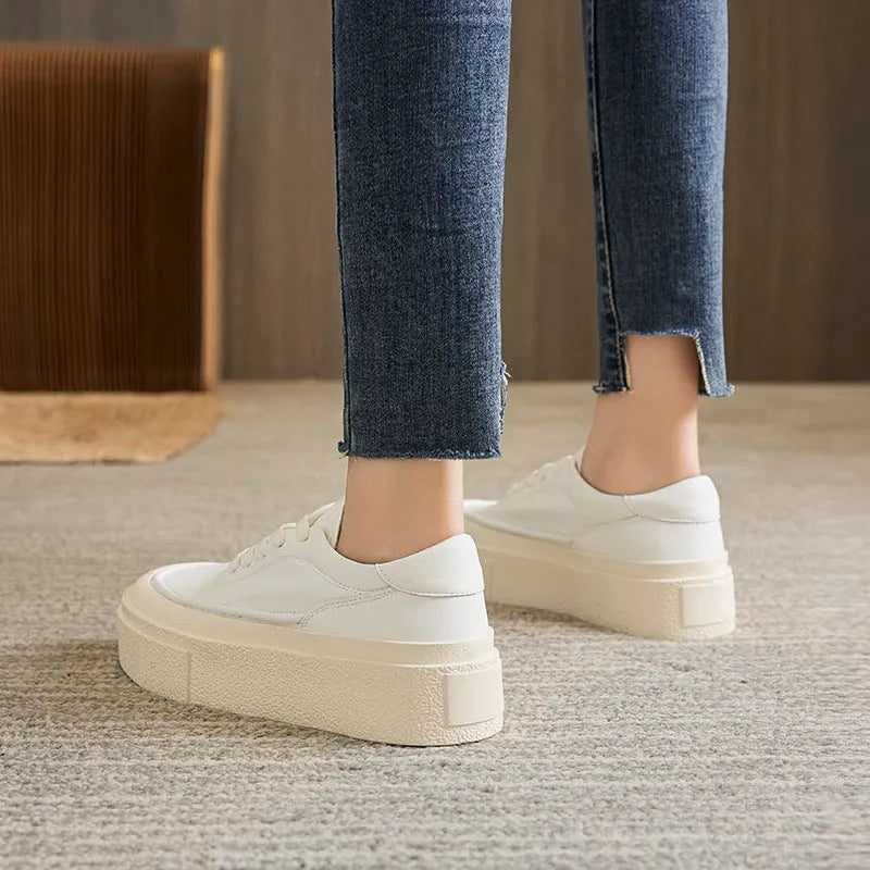Women's black platform casual sports shoes with embossed cowhide leather upper and round toe design