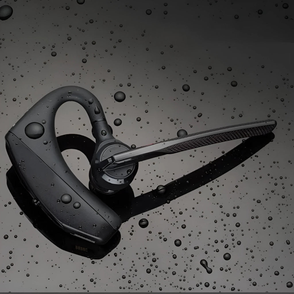 Black plastic Bluetooth sports headphones showing a battery display and USB connection.