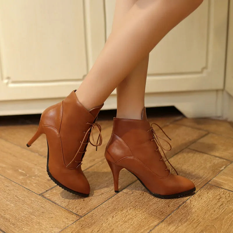 Women's lace-up Martin boots with stiletto heel in black, brown, and red