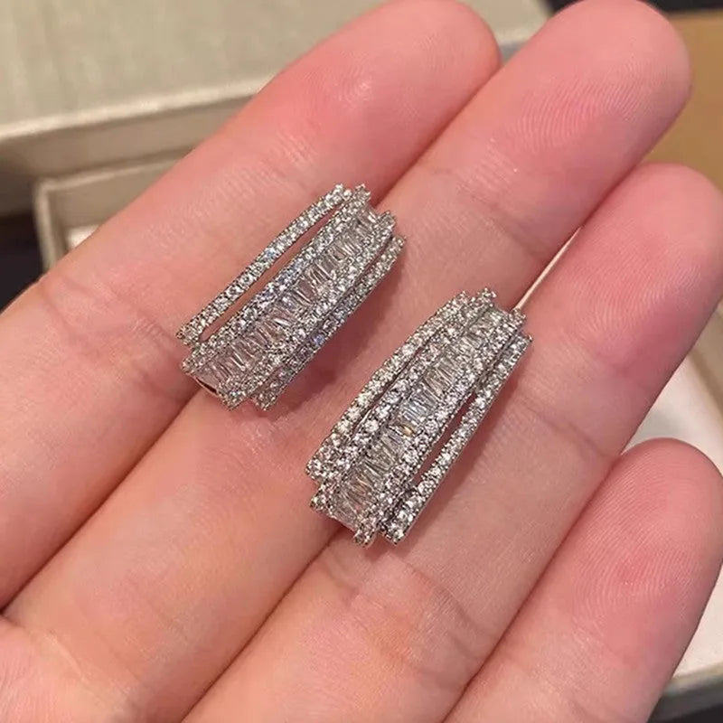 Women's geometric zircon stud earrings with white gold colour plating.