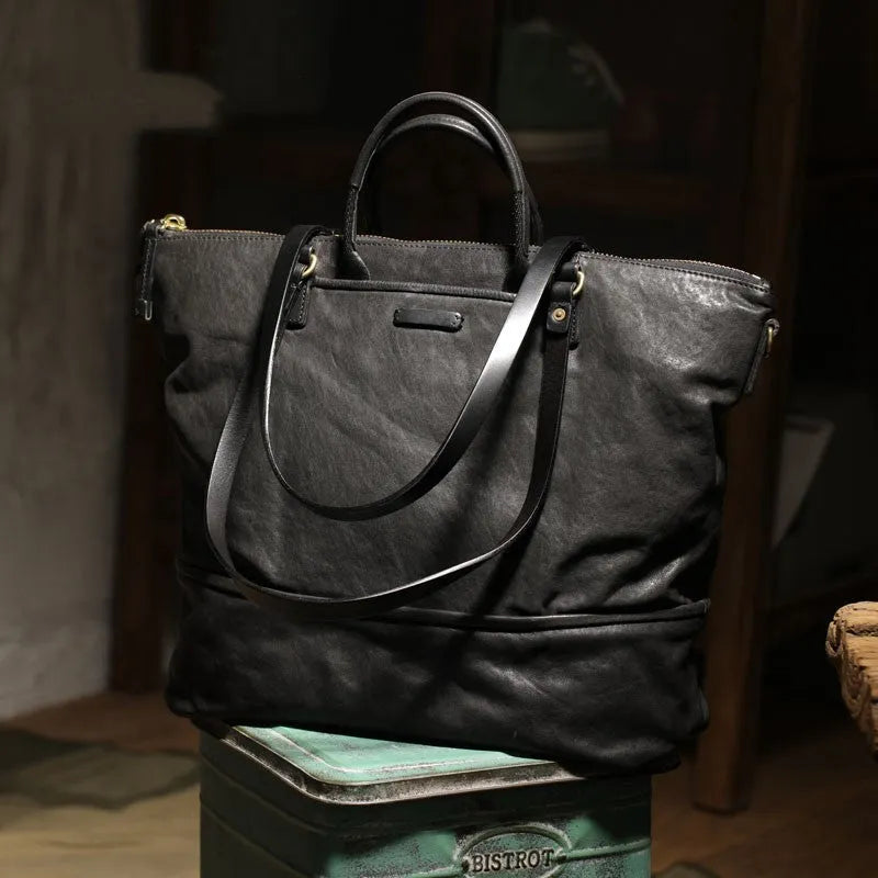 Black handmade vegetable tanned cowhide tote bag with zipper closure and large capacity for travel