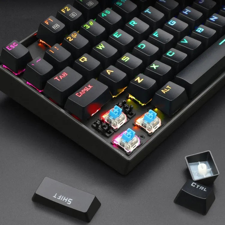 Monochrome wired mechanical gaming keyboard set with green axis switches, mouse, mouse pad, and headphones in coordinated black