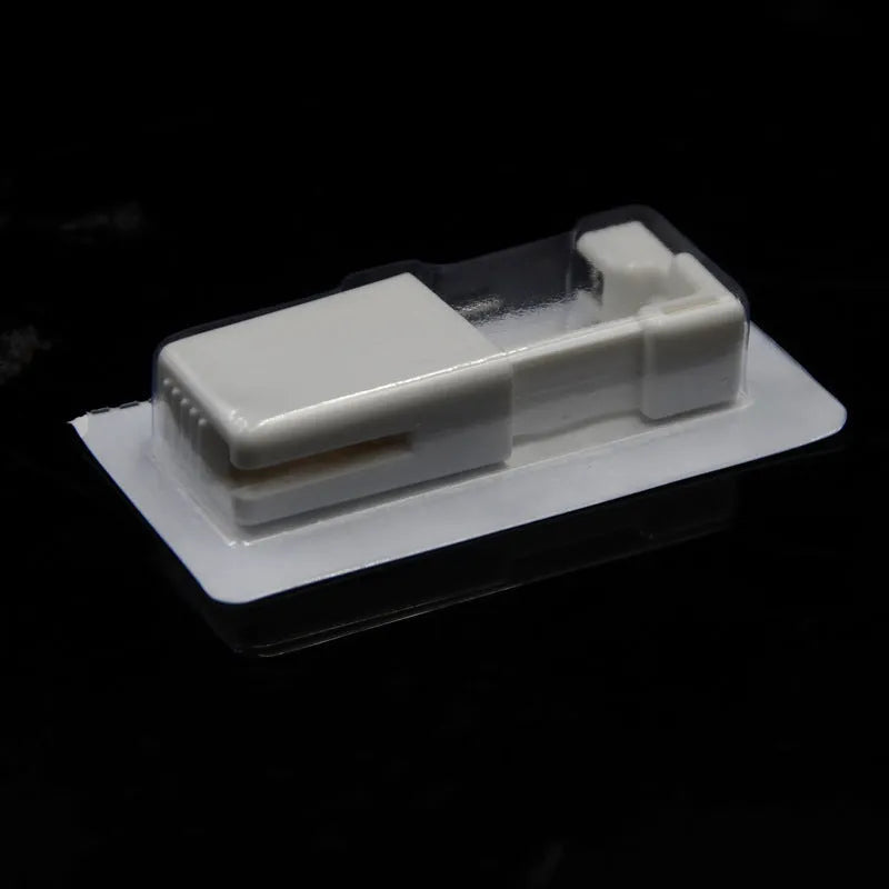 Disposable ear piercing gun with built-in crown stud in 316L stainless steel with zirconium inlay