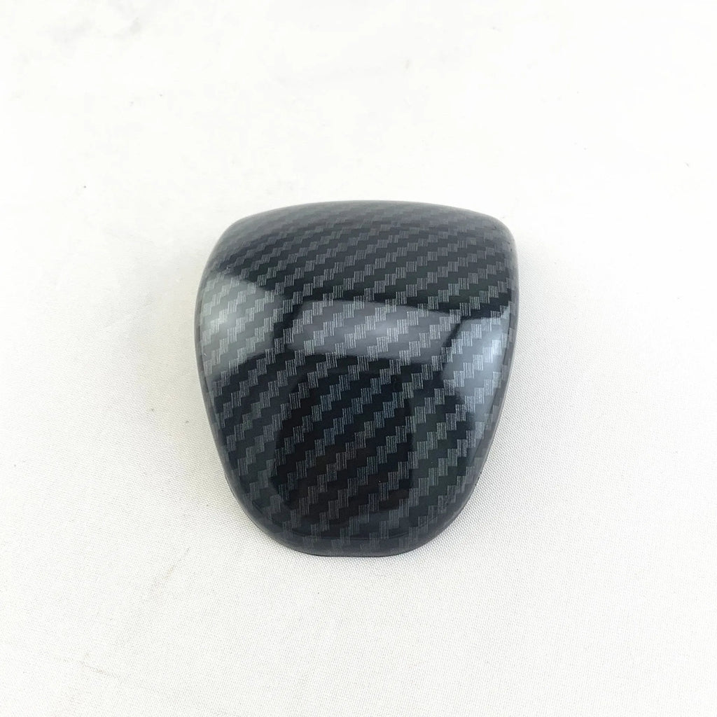 Smart RunK3 gear shift cover in carbon fibre pattern made from black ABS plastic.