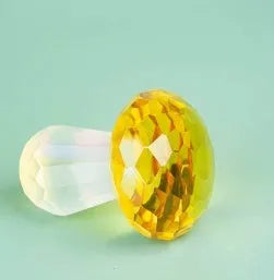 Colourful acrylic mushroom crystal decoration in geometric style, measuring 40mm by 53mm.