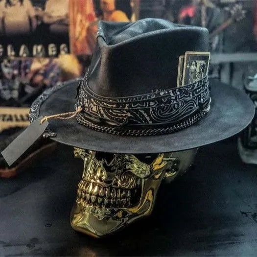 Handmade wool skull hat with conical crown and black and white embroidery for Halloween costumes.