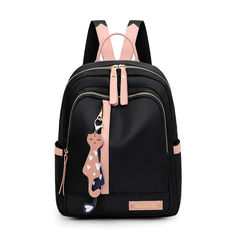Women's black casual nylon backpack with double shoulder straps showing interior organisation compartments