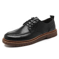 Men's black and brown casual leather slip-on shoes with round toe and visible sewing line detailing.