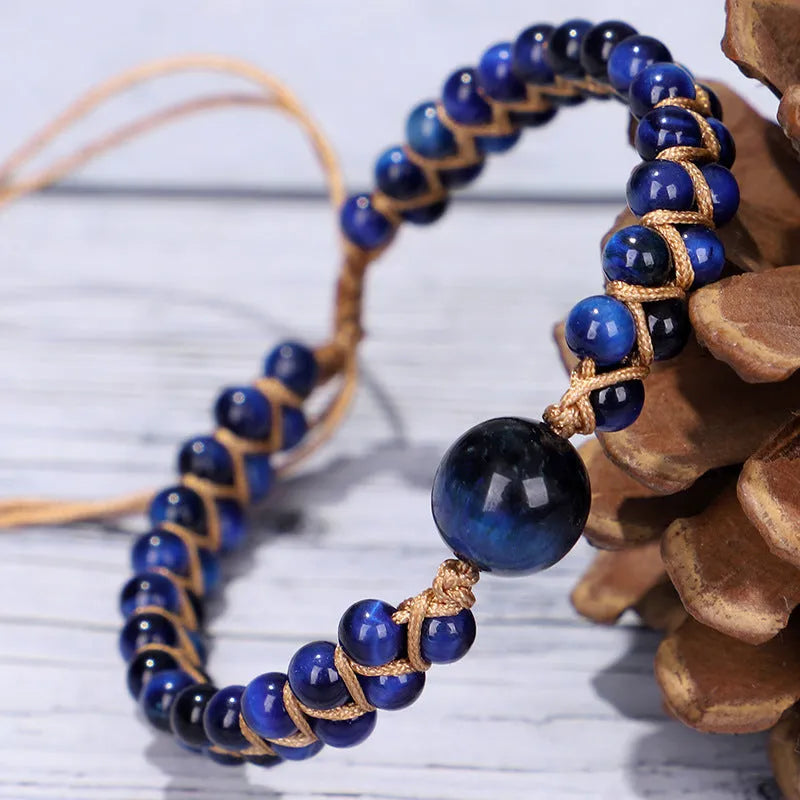 Handmade woven geometric pull bracelet with blue tigereye stone beads.