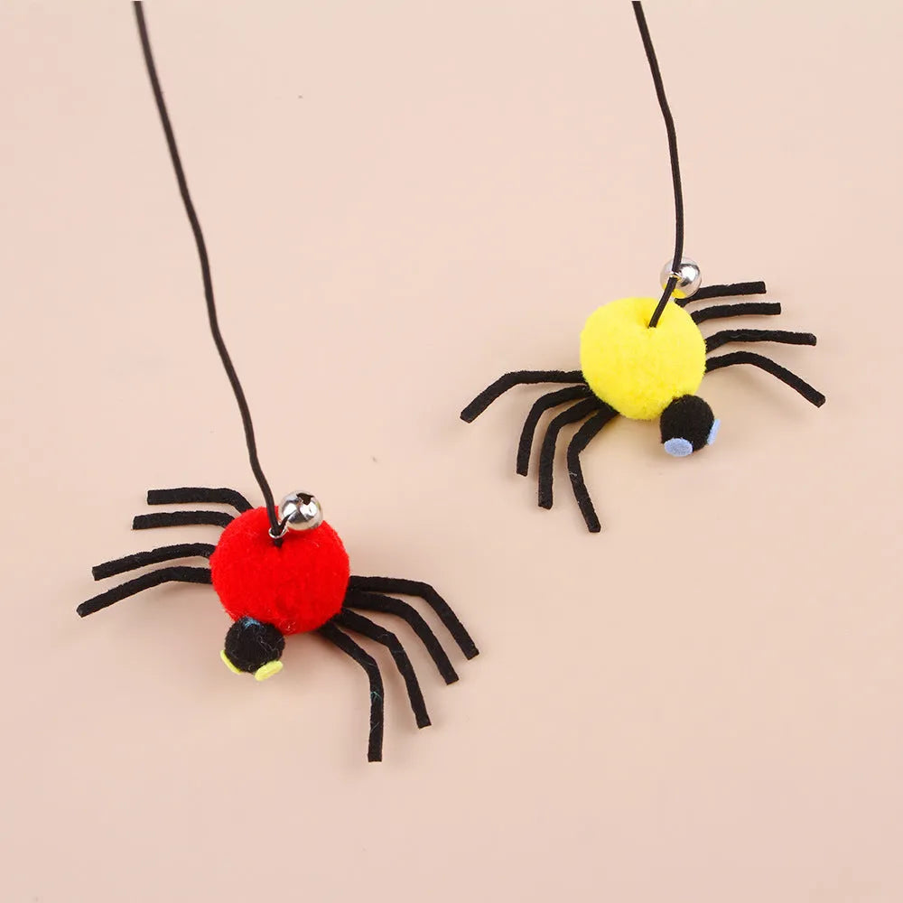 Cat hanging door toy with elastic rope featuring feather, bell and spider attachments in red or yellow colours