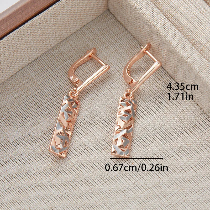 A pair of rectangular two-tone hollow stud earrings with a geometric design and electroplated alloy finish.