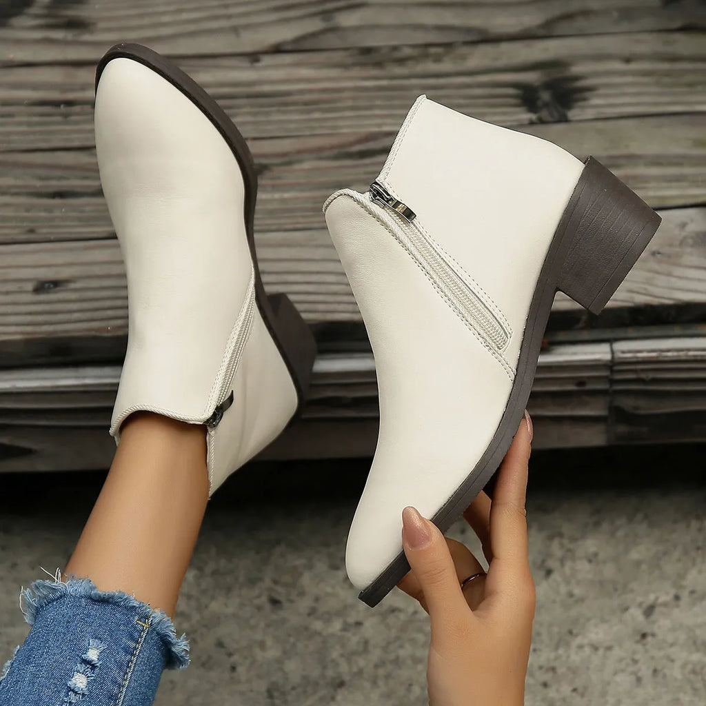 Women's chunky mid heel suede ankle boots with side zipper in off-white, front view