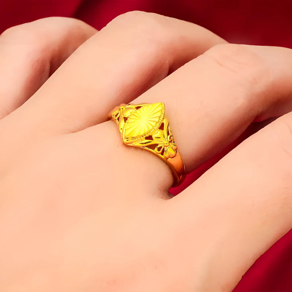 Gold-coloured brass flower ring with geometric texture and open diamond shape design