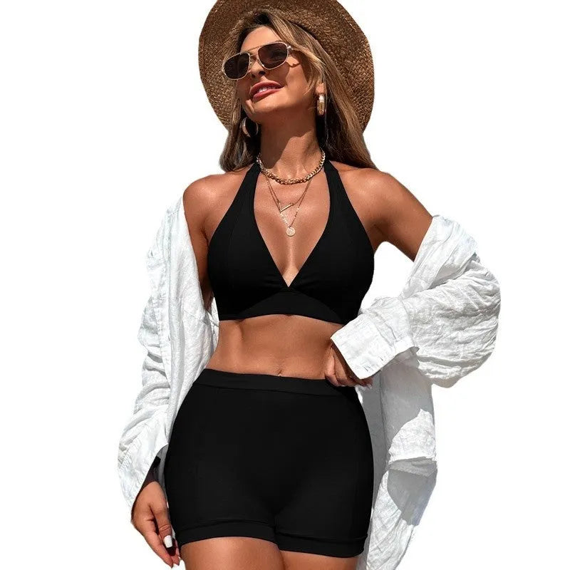 Women's black nylon bikini swimsuit with polyester lining, shown on model