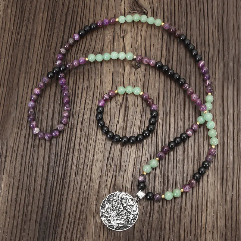 Dongling Long adjustable stone bead necklace with alloy lotus pendant and matching bracelet.