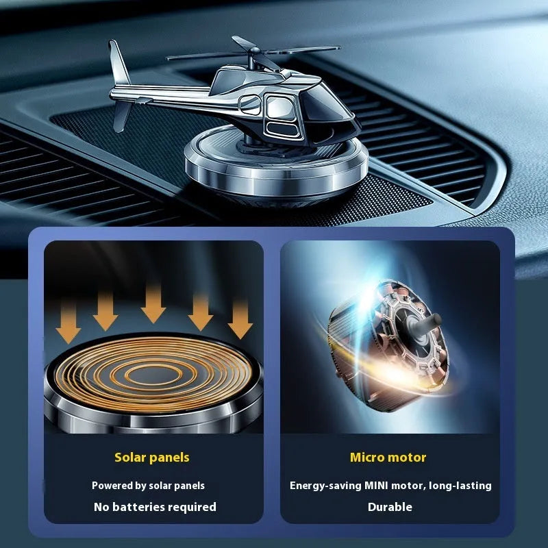 Silver solar-powered metal helicopter car ornament with rotating blades and air freshener function.