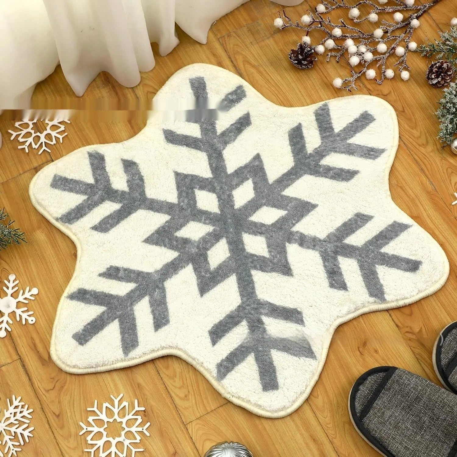 Round Christmas carpet with festive blanket design on floor beside holiday decorations