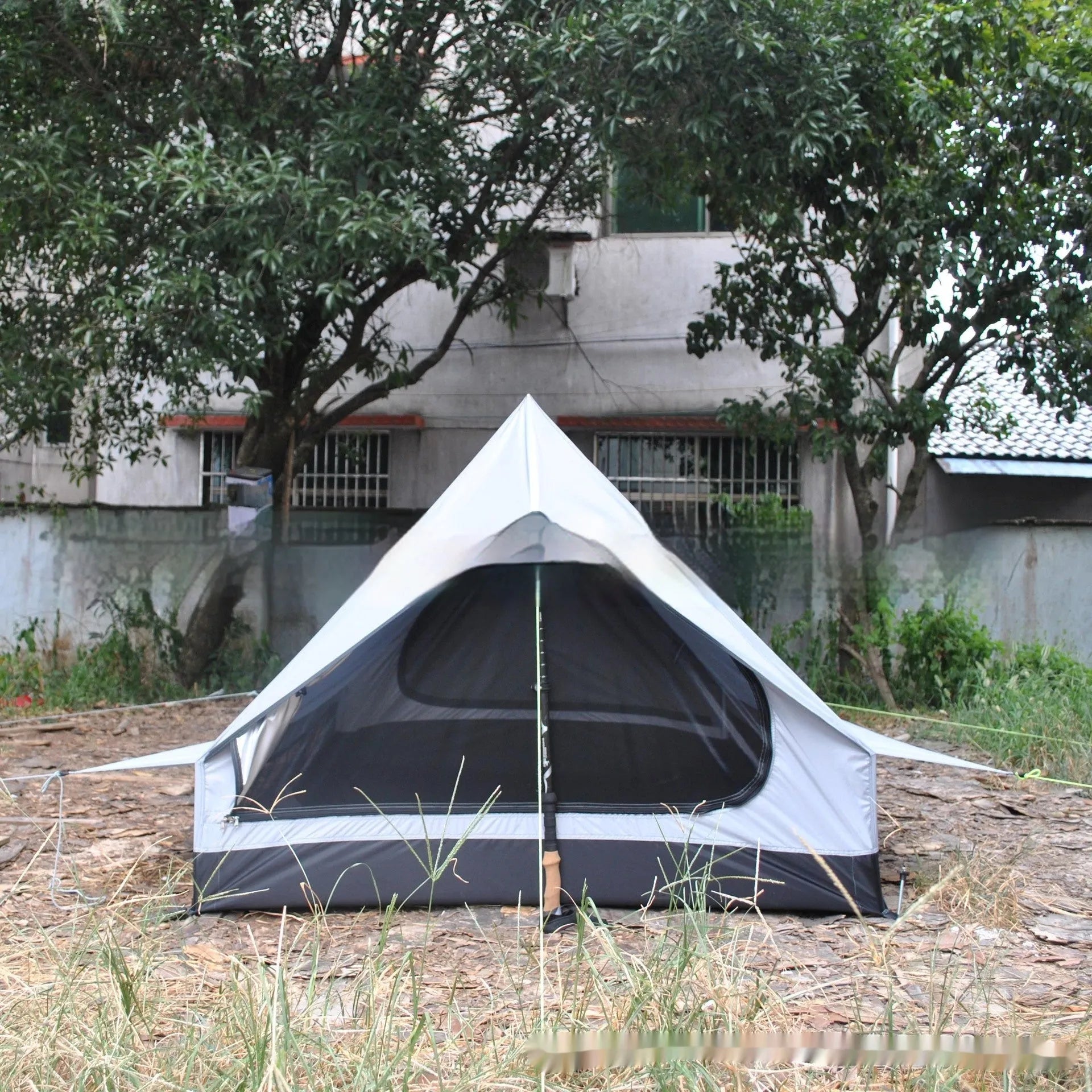 Brown or white A-line hiking tent pitched with hiking poles showing 210x150x110cm dimensions