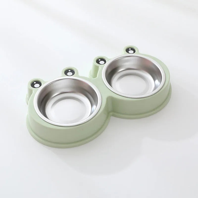 Stainless steel frog-shaped double pet bowl for food and water, available in blue, green, or pink.