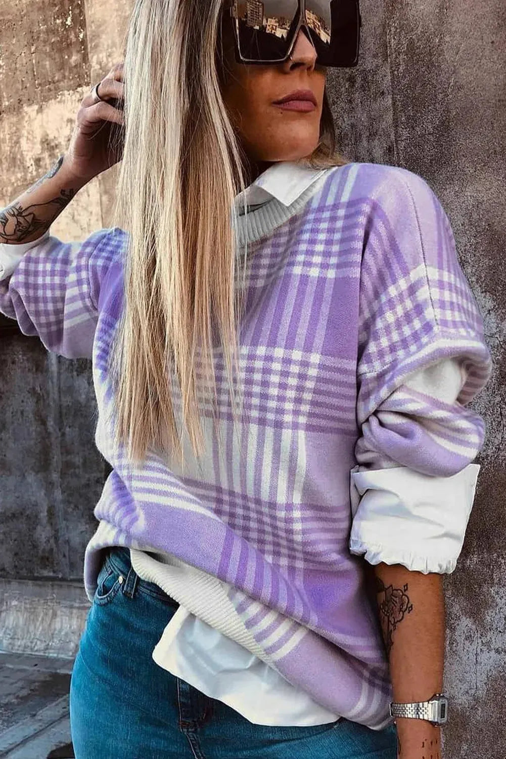 Loose fit long sleeve sweater in lilac plaid print with ribbed cuffs and hem.