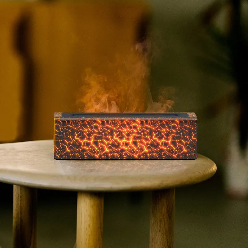 Square black creative lava USB humidifier and aroma diffuser with colourful LED flame lighting on a desk.