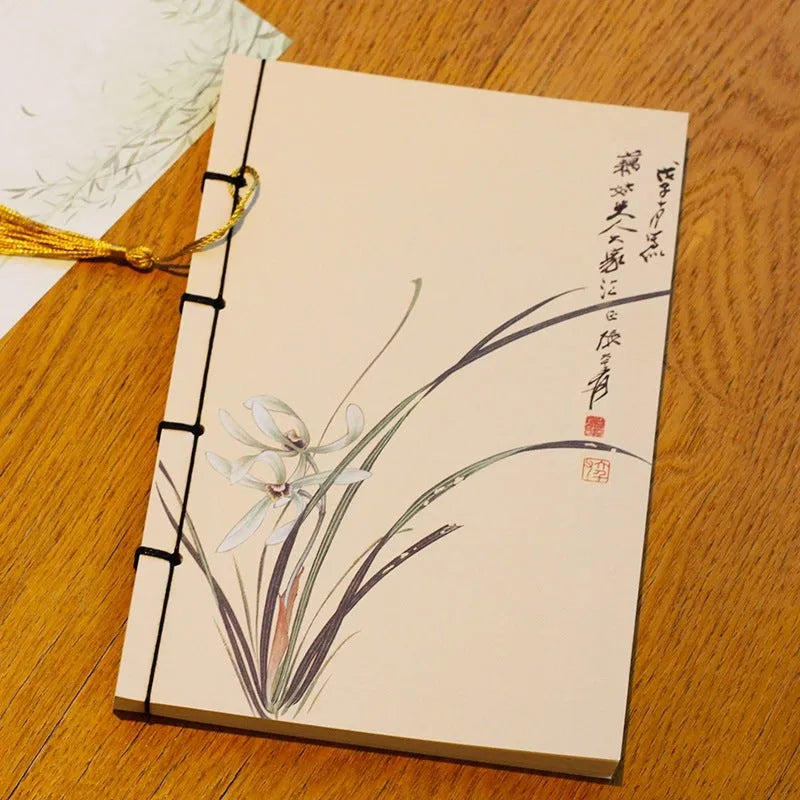 A5 antique thread-bound notebook with embossed cover and decorative tassels