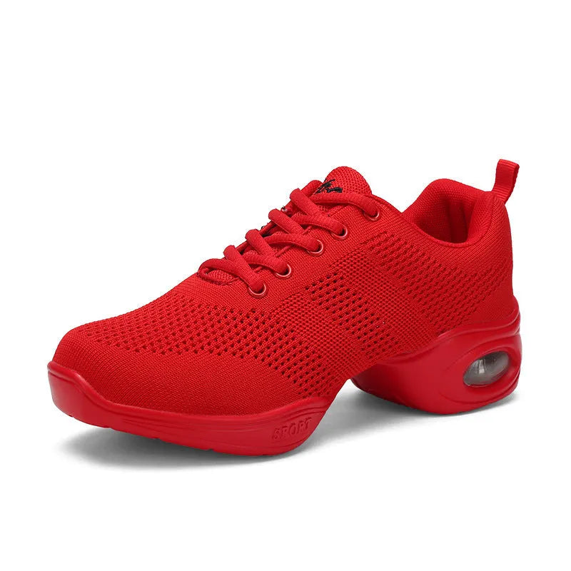 Women's white breathable mesh dance shoes with a lightweight PU sole on a studio floor.