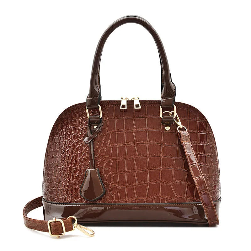Black shiny PU crossbody bag with shell shape, showing size and polyester lining.