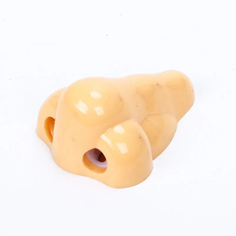 Flesh coloured plastic pencil sharpener with big nostril design for manual pencil sharpening