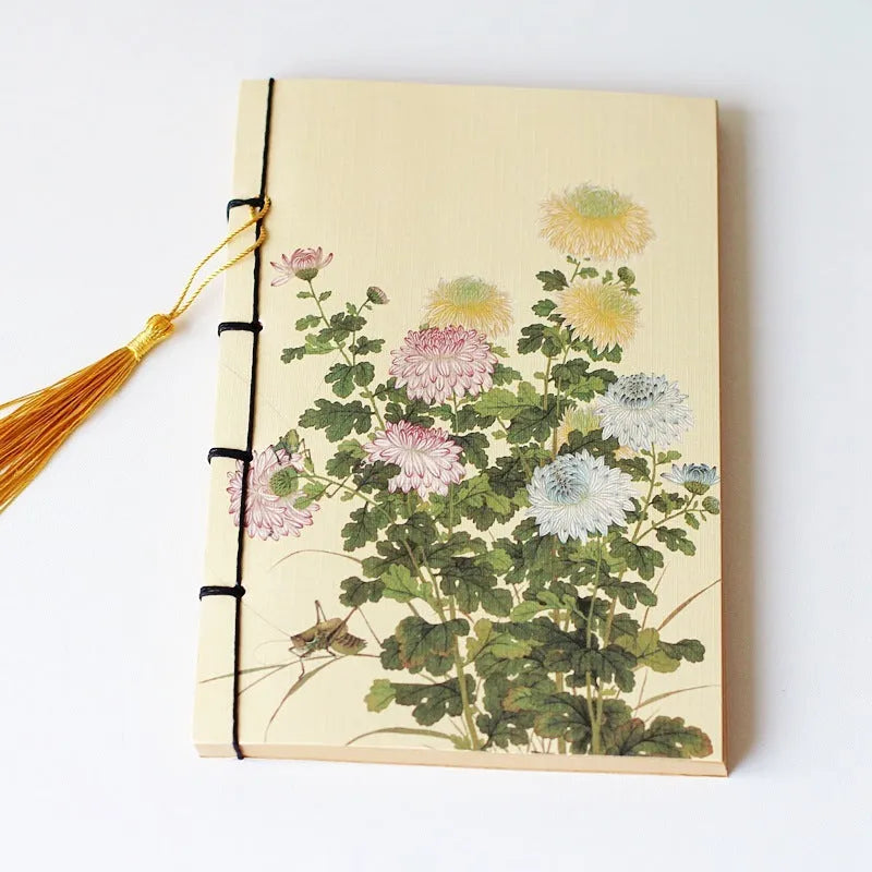 A5 antique thread-bound notebook with embossed cover and decorative tassels