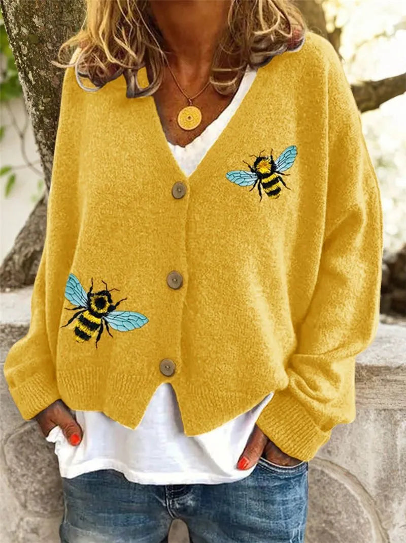 Loose fit animal pattern knitted cardigan sweater in black, made from polyester, with conventional sleeves.