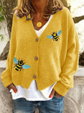 Loose fit animal pattern knitted cardigan sweater in black, made from polyester, with conventional sleeves.