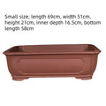 Handmade purple clay rectangular bonsai pot showing traditional ceramic construction