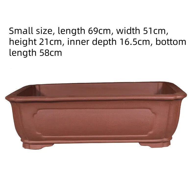 Handmade purple clay rectangular bonsai pot showing traditional ceramic construction
