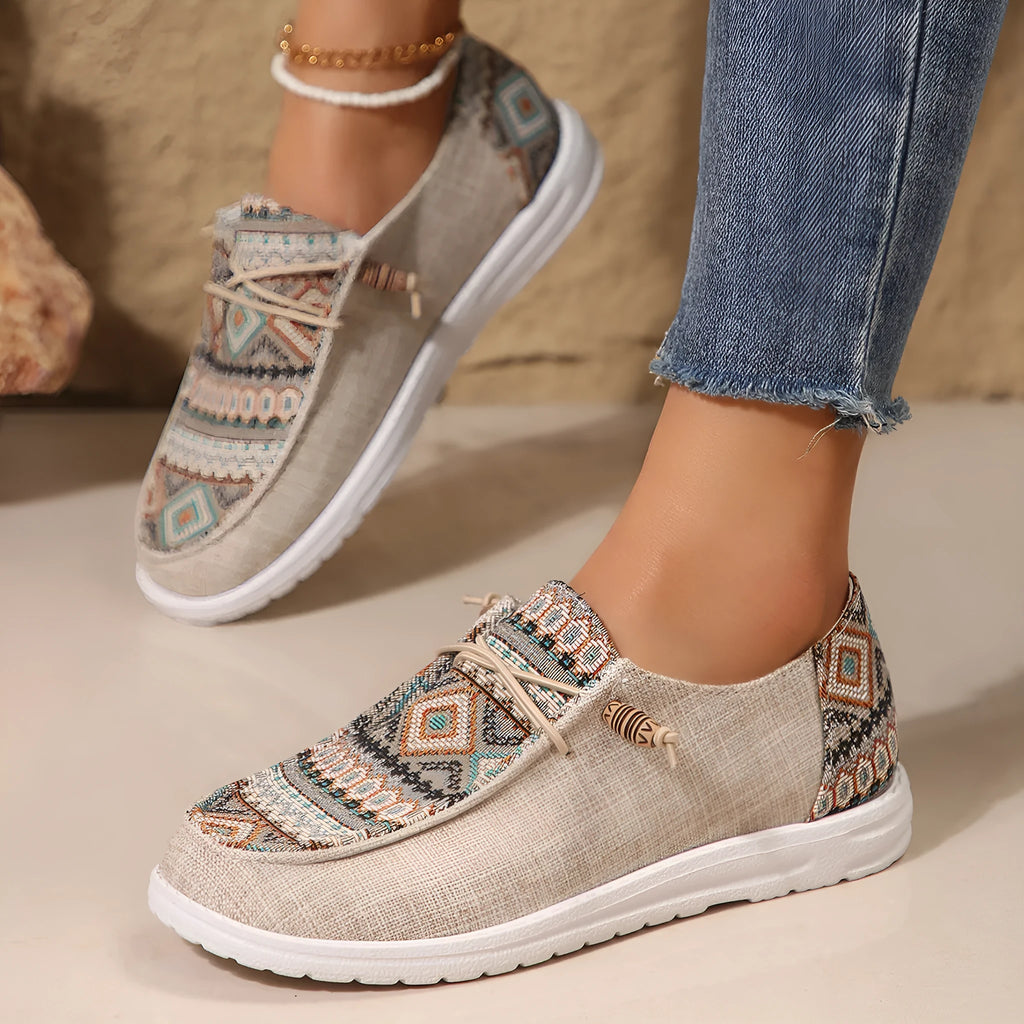 Women's black round toe flat shoes with a low-top PU upper and rubber sole on a plain background.