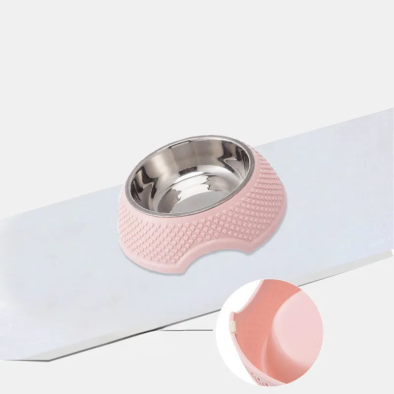 Blue stainless steel pet bowl with non-slip base on a floor