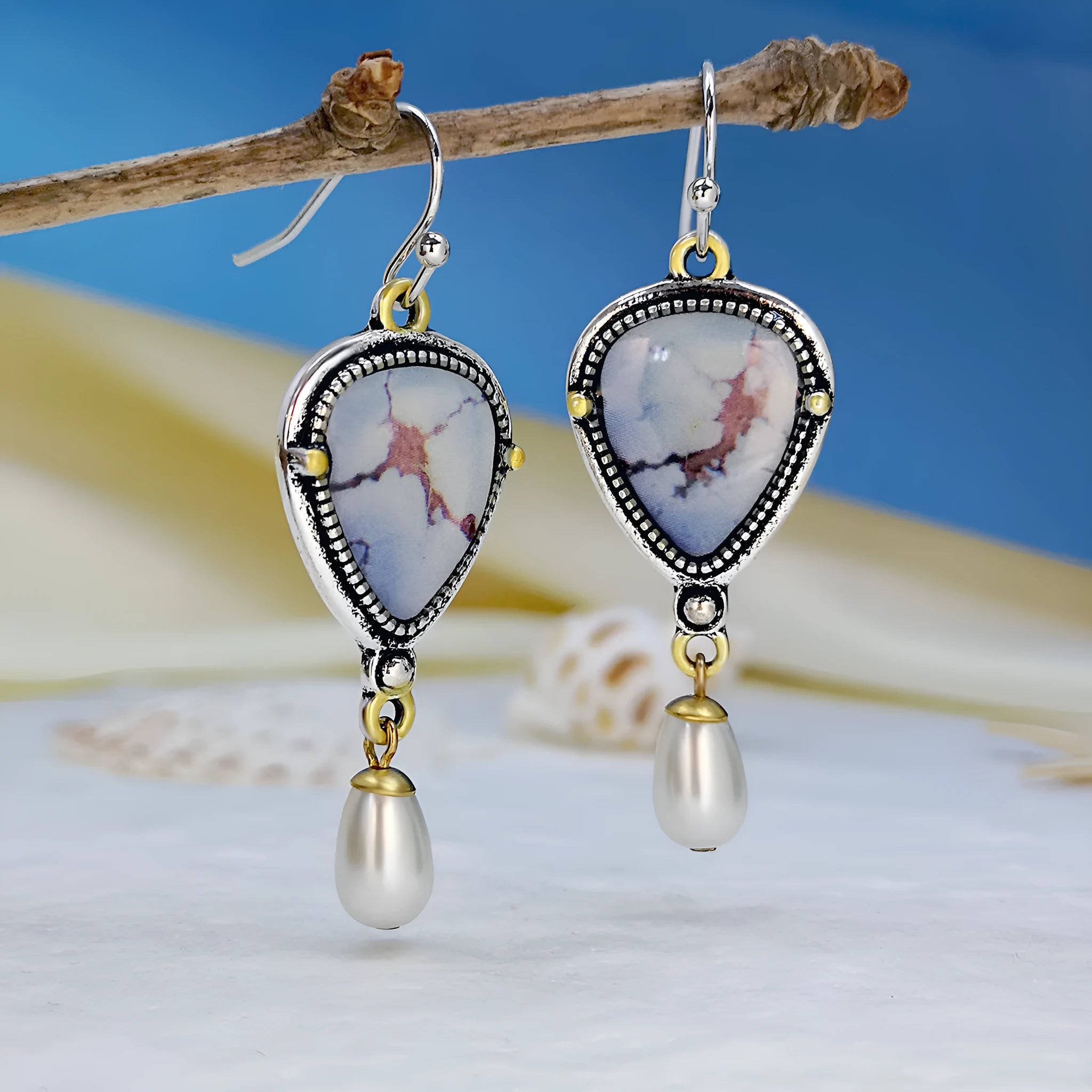Retro blue drop earrings with geometric design and synthetic opal pearl details