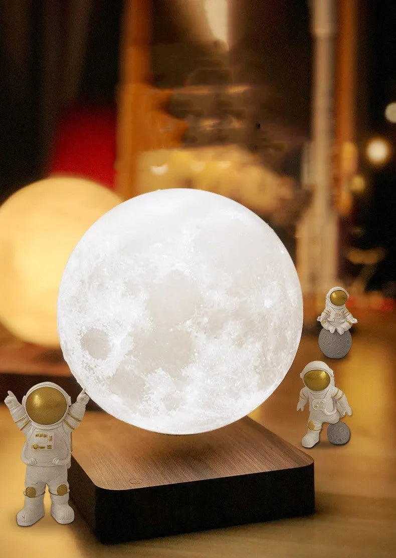 Maglev floating moon and earth night light with three astronaut figurines and soft LED glow.