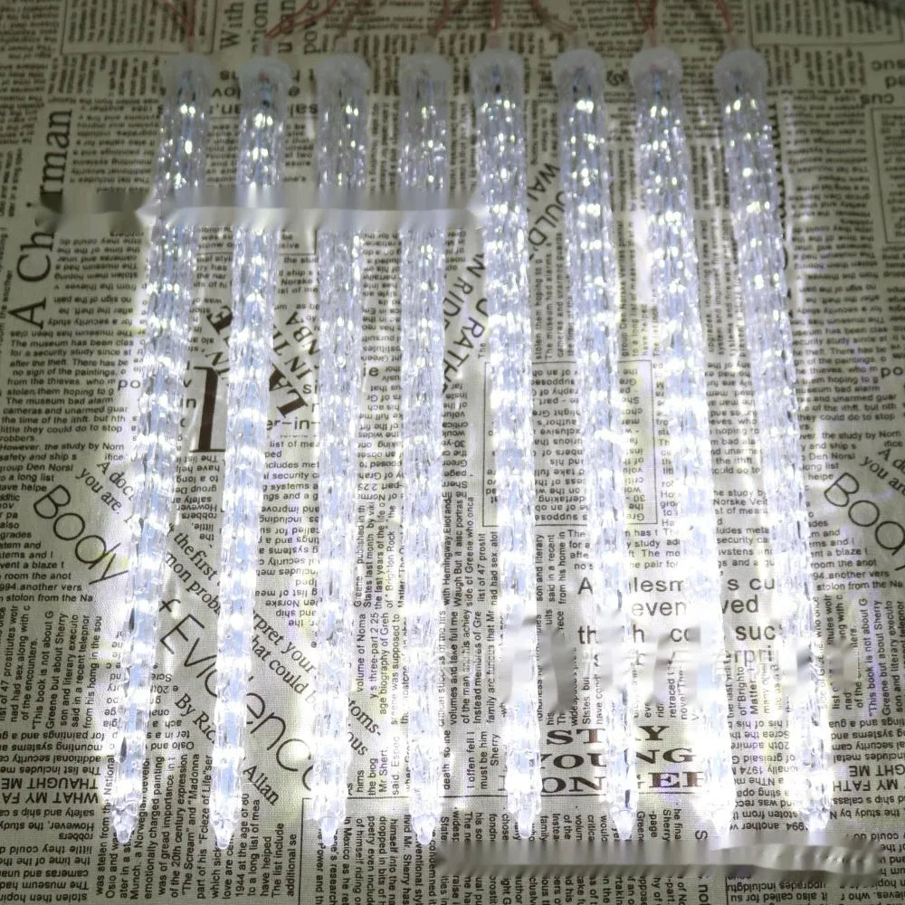 Solar-powered ice cone shaped meteor shower LED festoon lamp for outdoor garden lighting.