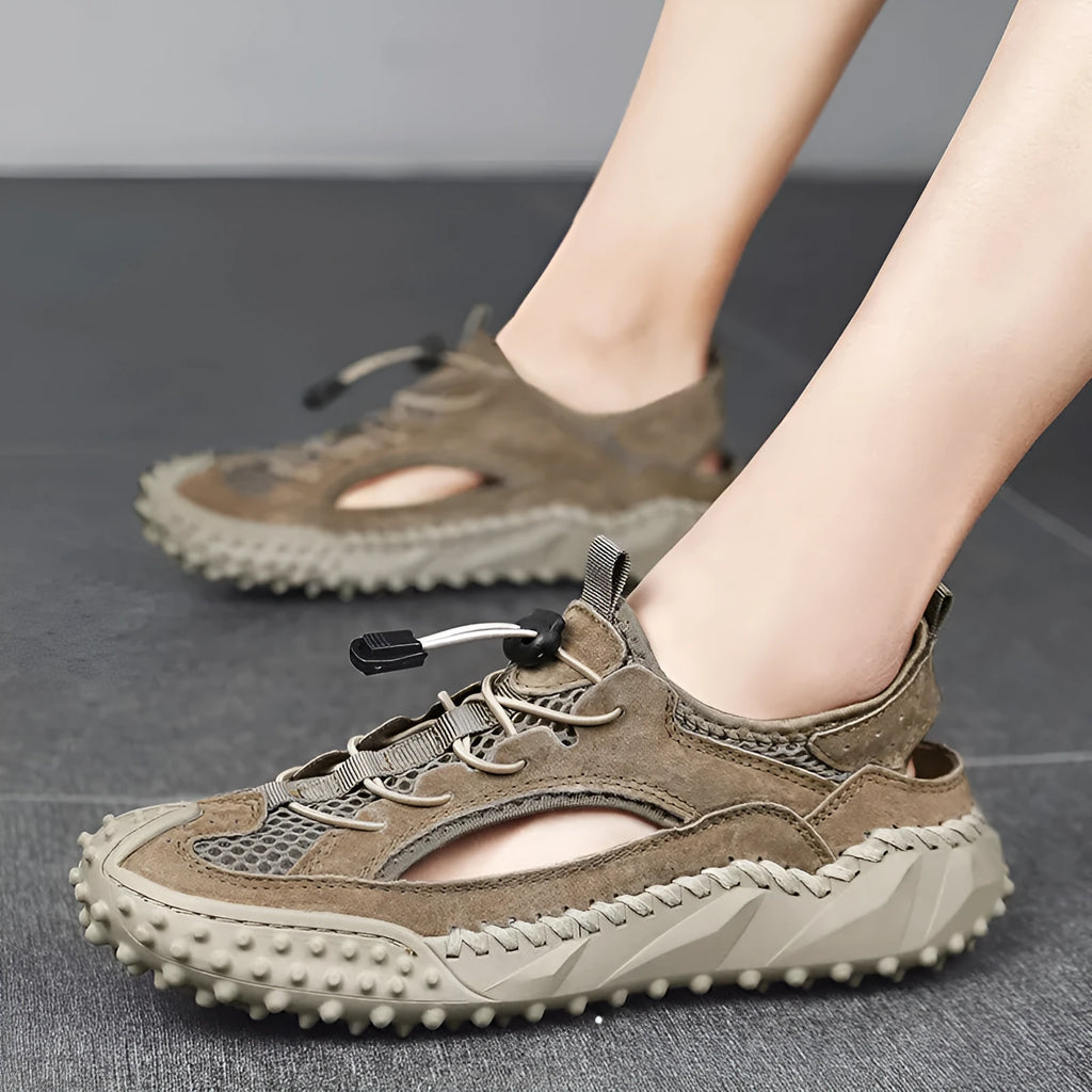 Men's black waterproof casual sports sandals with a leather mesh upper, elastic band, and rubber sole.