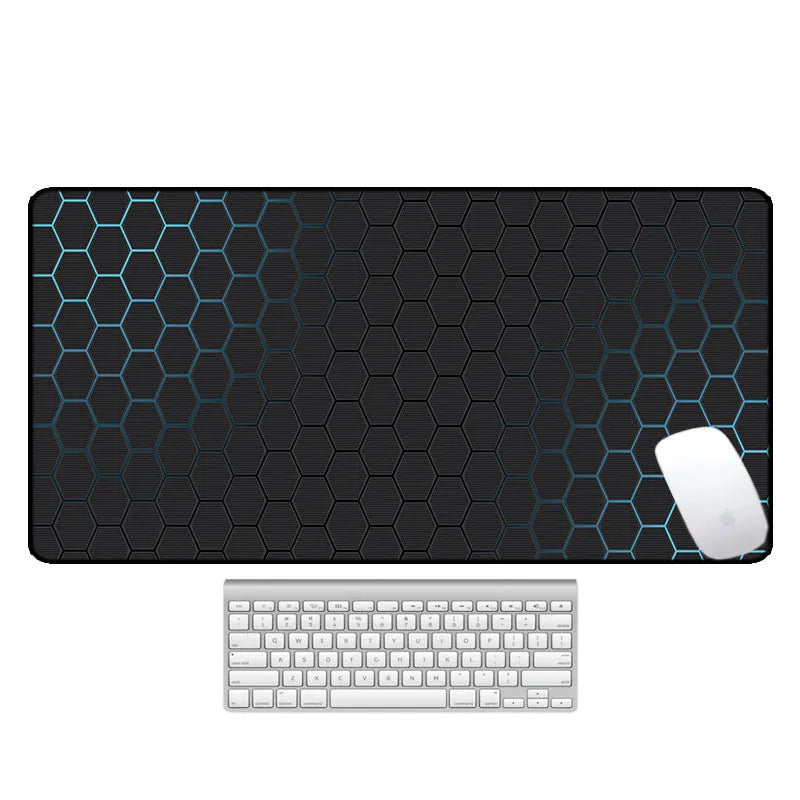 Large rectangular desk mouse pad with colourful printed pattern on natural rubber non-slip base.