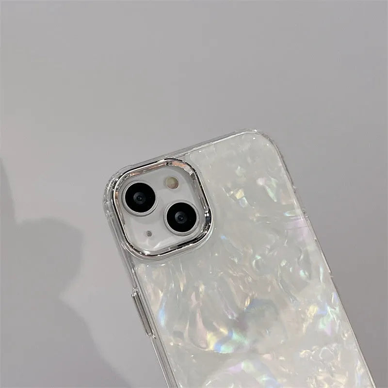 White TPU phone case with fantasy shell pattern compatible with iPhone 13 showing back design and side buttons
