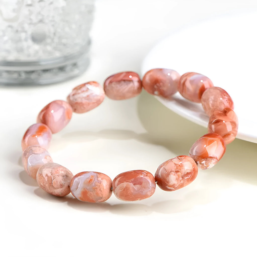 Natural cherry agate bracelet with barrel-shaped beads and Ruyi design element