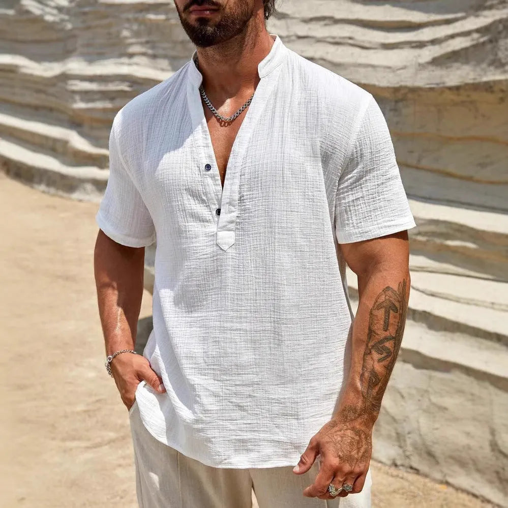 Men's solid colour short-sleeve shirt with a stand collar on a hanger.