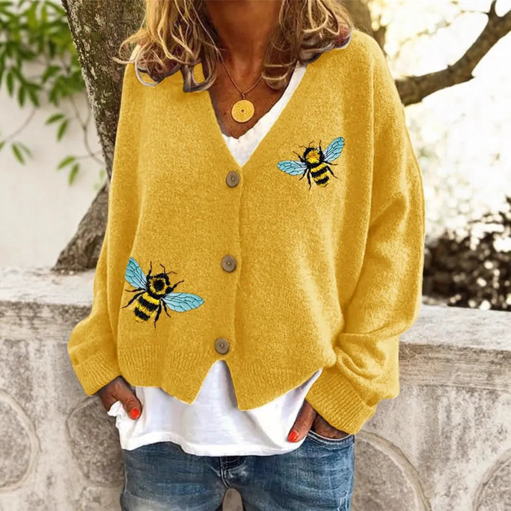 Loose fit animal pattern knitted cardigan sweater in black, made from polyester, with conventional sleeves.