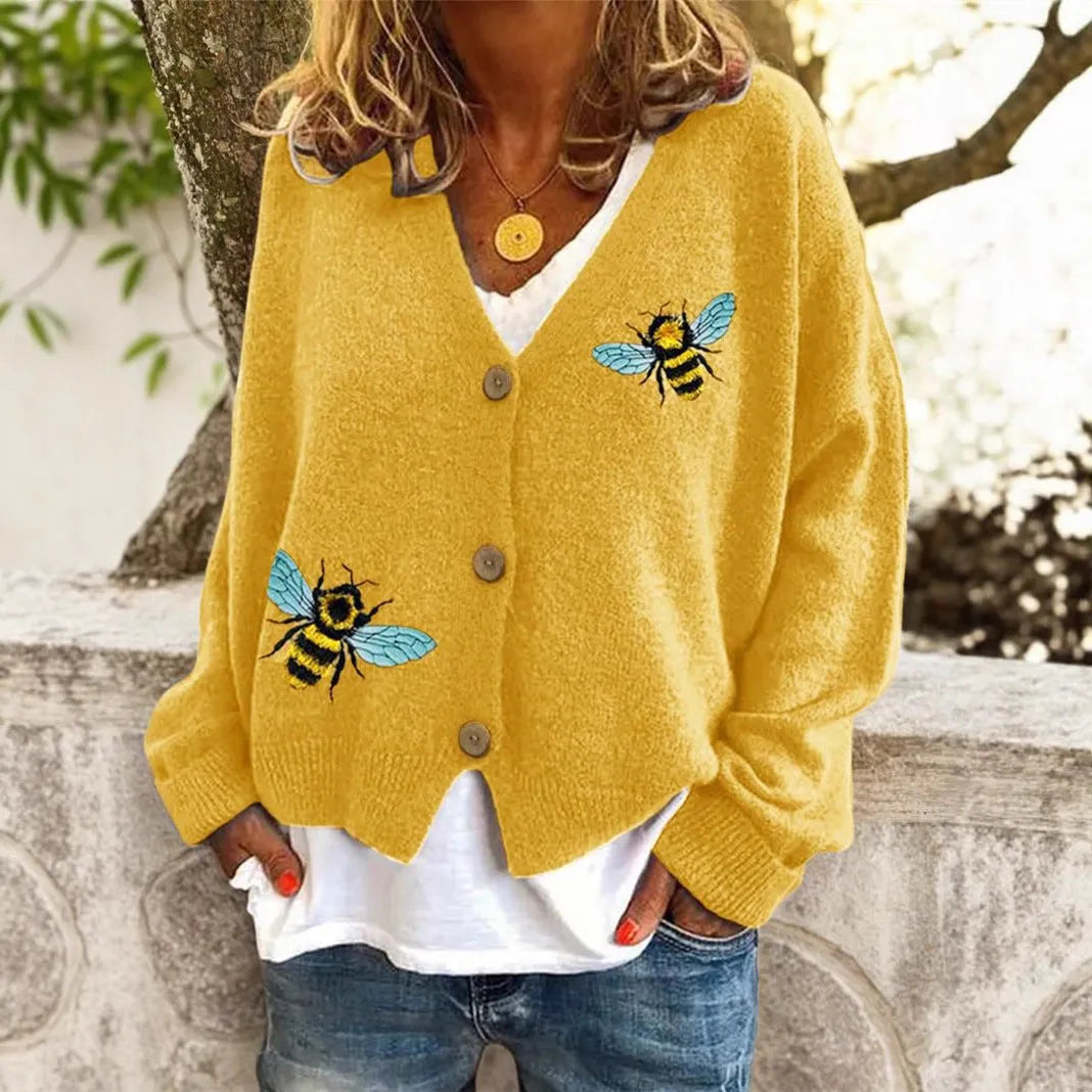 Loose fit animal pattern knitted cardigan sweater in black, made from polyester, with conventional sleeves.