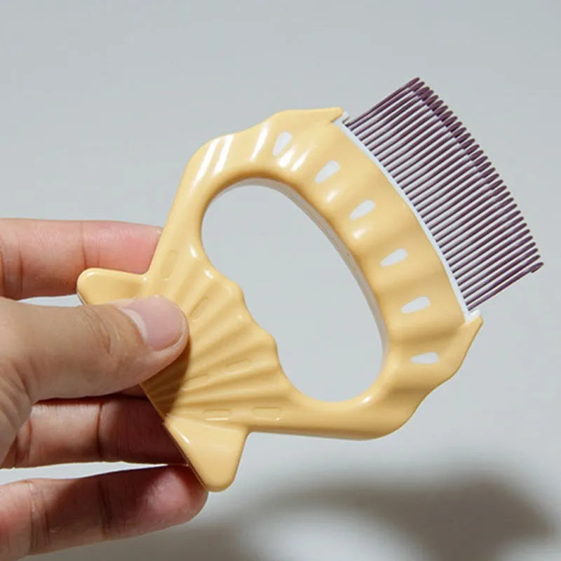 Green shell-shaped pet grooming brush with bent wire bristles and a plastic anti-slip handle.