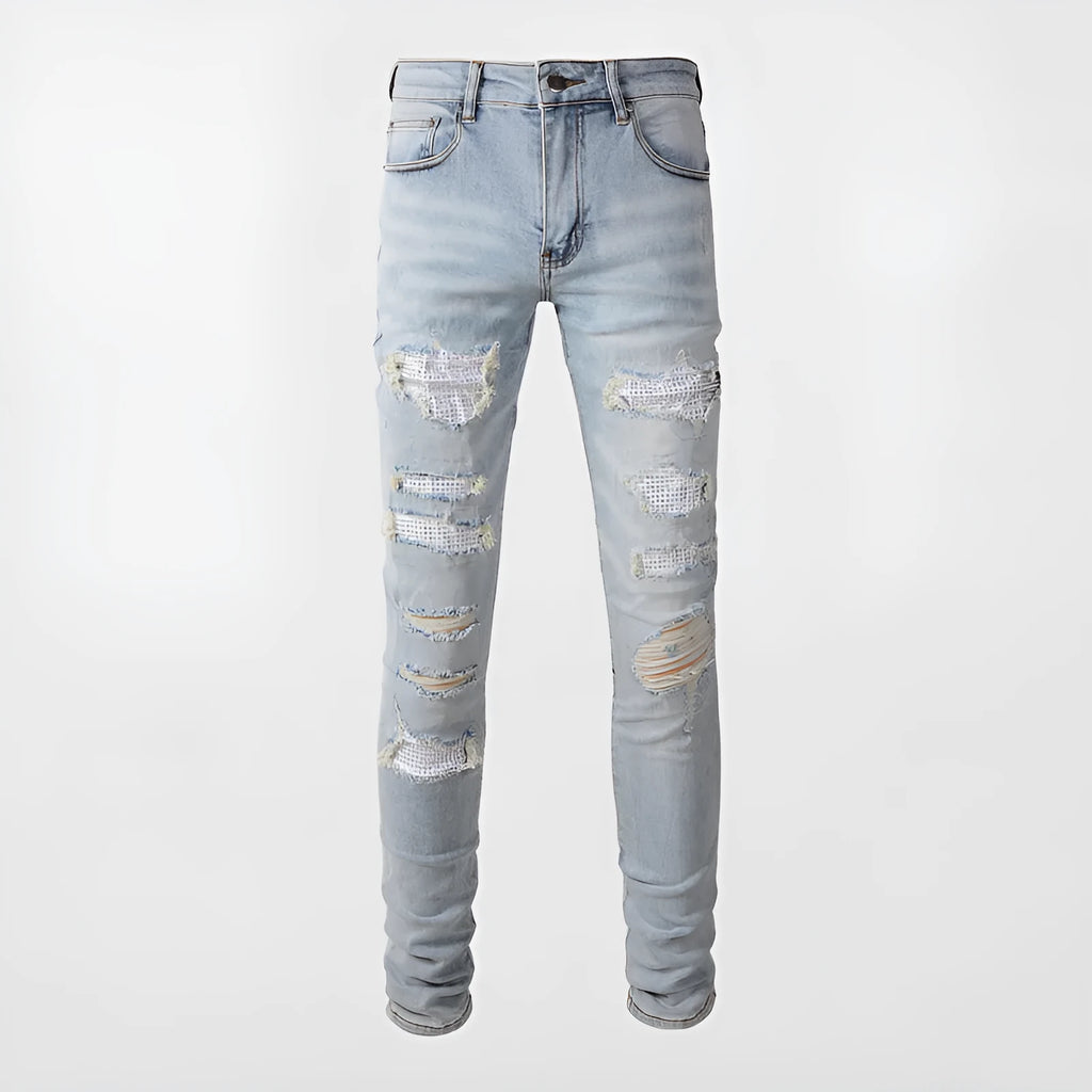 Light blue men's elastic slim fit jeans with hot diamond patch and whisker scrape detailing
