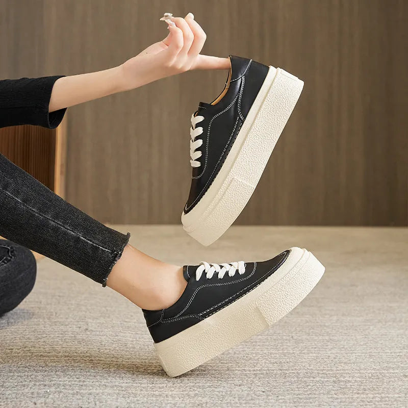 Women's black platform casual sports shoes with embossed cowhide leather upper and round toe design