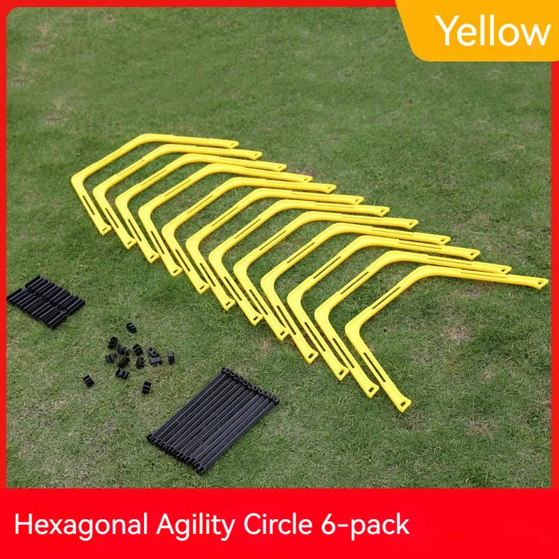Set of six foldable yellow, green, and orange hexagon football agility training rings on grass